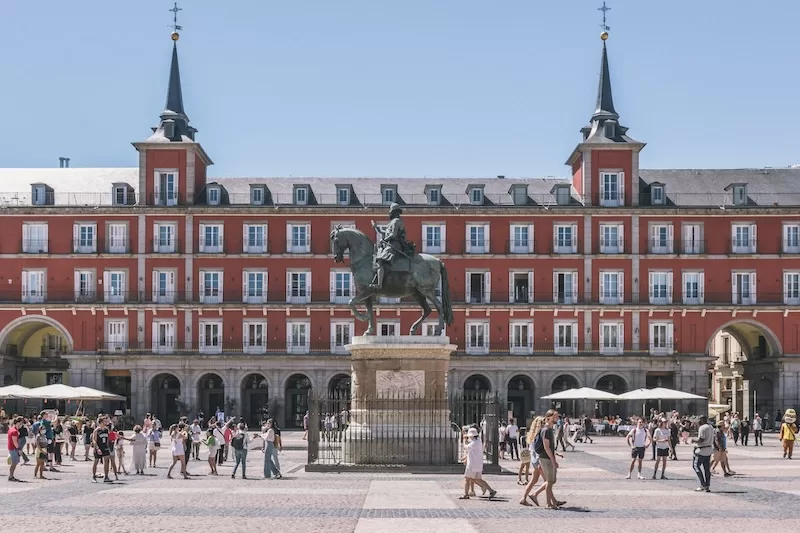 In Spain, life naturally spills outdoors, making smaller apartments feel larger through daily connection with public spaces.