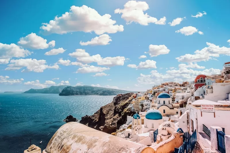 Santorini’s whitewashed cliffs and blue domes capture what Greece does best: beauty with permanence. For many investors, it’s not just a view, but the start of an EU home base with real staying power.