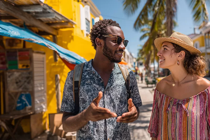 A Belizean tour guide chats with a visitor under the Caribbean sun. Every friendly exchange shows how language turns connection into opportunity.