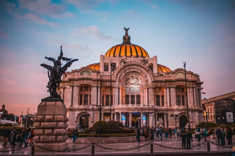 Finding your city takes time. Just like Mexico City’s Palacio de Bellas Artes glowing at dusk, the beauty of a place reveals itself slowly, in the days between first impressions and real connection.