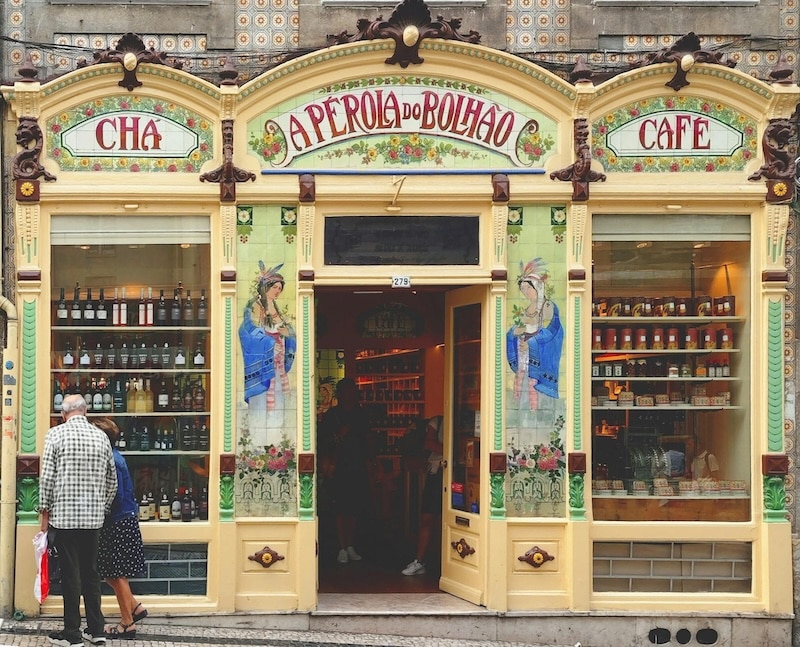 A Pérola do Bolhão, one of Porto’s most beloved old shops, where time seems to have paused between art nouveau tiles and shelves of wine and tea.