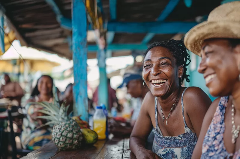 A shared laugh at a local café. In Belize, language bridges lives, making every exchange feel like a conversation among friends.