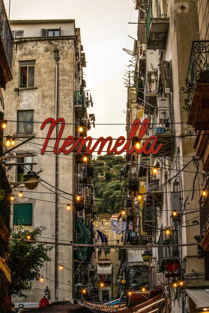 Evening light in Naples, where life costs less but feels full. Street chatter, laundry lines, and trattoria signs glowing into dusk, a reminder that value in Italy isn’t just about money, but about moments.