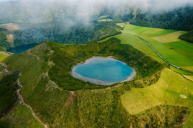 The wild beauty of the Azores: green hills, light fog, blue lakes in volcanic craters, and endless peace.