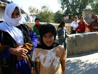 Kurdish women in traditional dress at community gathering in the Kurdistan Region, representing the vibrant cultural life and social fabric of Kurdish society