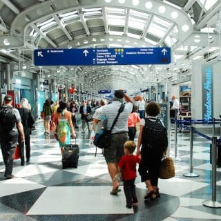 U.S. Government shutdown - Travelers queue at airports