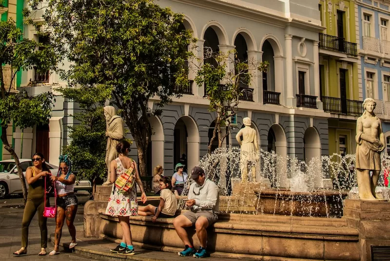 Warm weather turns public plazas into living rooms, giving retirees more motion, more sunlight and more community than any gym membership ever could.