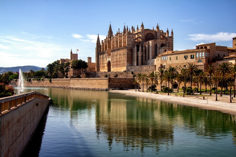 Palma’s Gothic cathedral mirrored on the bay captures the city’s essence: light on stone, history meeting the sea.