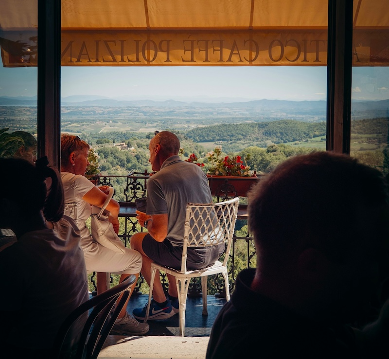 A café view over the Val d’Orcia. Tuscany’s luxury isn’t in extravagance, but in having time to enjoy what’s already there.