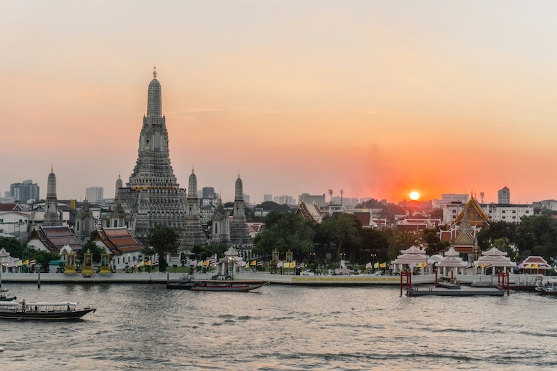 Sunset over the Chao Phraya River adds beauty to daily routines in Bangkok, yet the capital’s skyline also signals higher living costs. Choosing Thailand’s big-city energy or a quieter provincial base shapes how far a monthly budget goes.