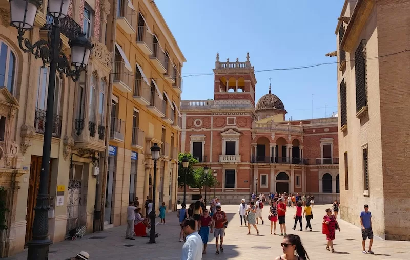 Historic architecture and warm streets set the tone in Valencia, a city where life moves slowly and comfortably without straining your budget.