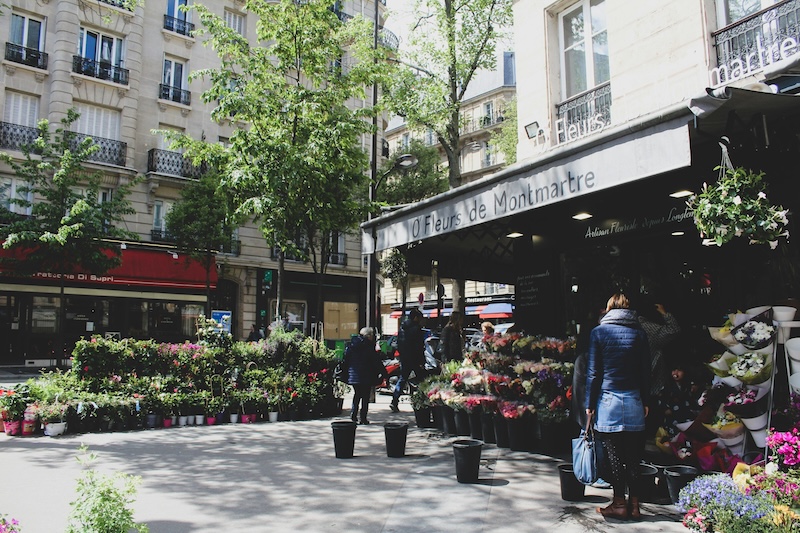 In France’s smaller neighborhood, life happens through small rituals: a coffee taken standing up, flowers bought on instinct, a long lunch that rearranges the afternoon.