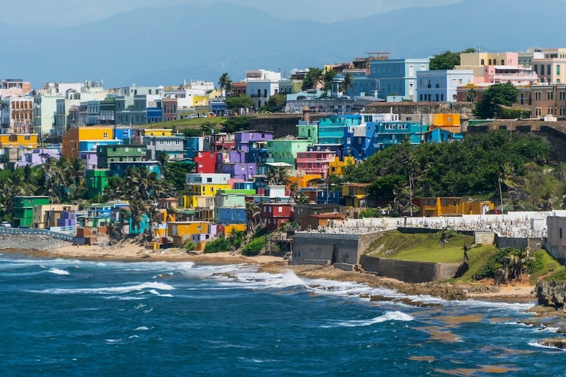 The colorful hillside of San Juan’s La Perla neighborhood stands as both symbol and story: a community shaped by the sea, rebuilt with spirit after every storm.