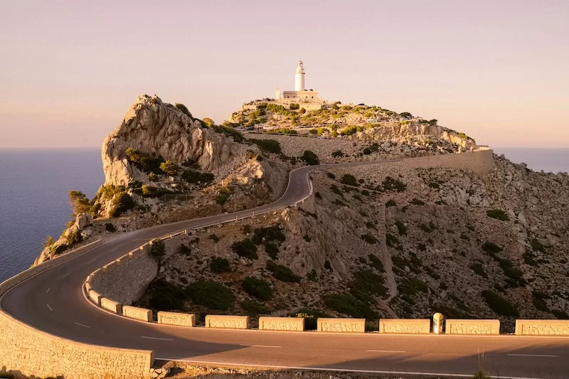 The roads of Mallorca reward the unhurried. Long, looping drives where each turn opens to sea light and limestone cliffs, and every journey feels like a small discovery.