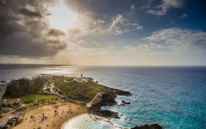 A lighthouse on Puerto Rico’s northwest coast faces the horizon after a passing storm, a symbol of endurance in a place where beauty and resistance coexist.