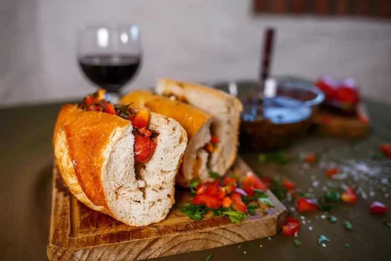 A snack built for celebration. Choripán and pebre teaming up to keep the party moving.