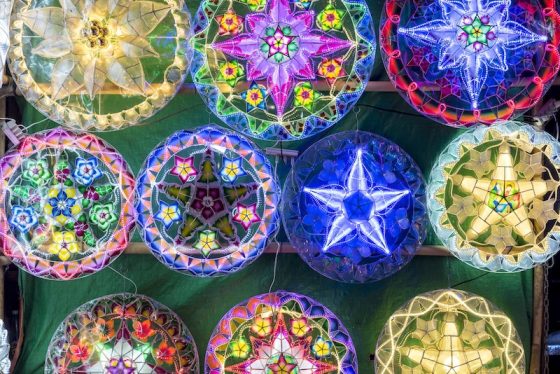 Colorful illuminated Christmas decorations and lanterns displayed in Manila Philippines showing extended Christmas season celebration and festive traditions