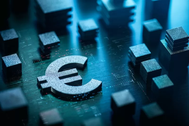 Euro currency symbol on digital circuit board with blue technology background representing European Union's digital euro central bank digital currency initiative