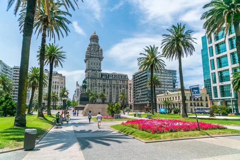 Plaza in Montevideo, Uruguay showing historic tower and modern city development, representing Uruguay's stability and appeal as a small country expat destination
