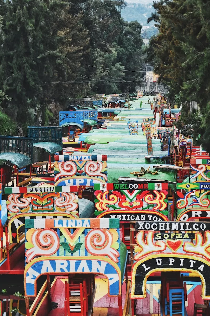 Colorful decorated buses and jeepneys in Mexico showing vibrant culture and practical relocation destination with flexible living options for expats abroad