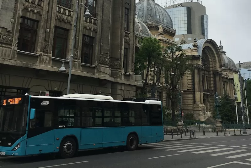 Modern public transport bus showing affordable European cities with reliable transit networks making car ownership optional for residents