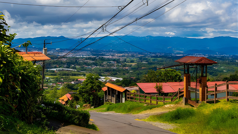 Hillside roads wind through older neighborhoods where fruit trees lean over fences and the valley opens wide below. Escazú keeps its roots visible, even as comfort rises all around it.