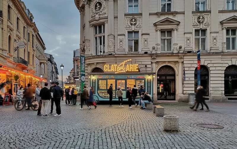 Bucharest Romania street scene with cafes and historic architecture showing affordable European city for remote workers and long-term residents