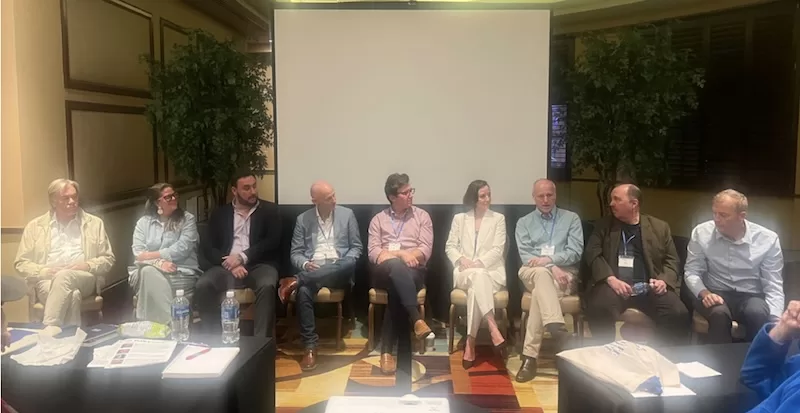 Expert panel at the Plan B Summit discussing international living, finance, and global strategy. Speakers share insights on asset protection and second citizenship.