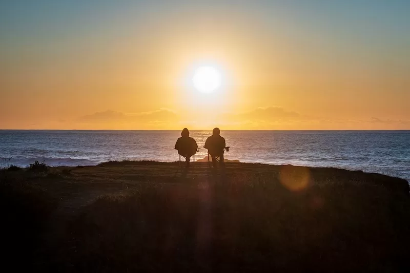 Retirees overlooking the ocean after relocating through long-term residency visas