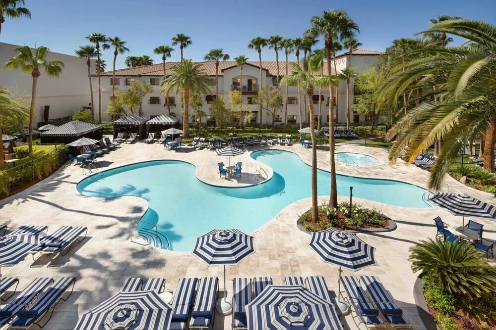 The serene pool at the Tuscany Hotel in Las Vegas, the venue for the Plan B Summit, offering a focused setting for networking with global experts and attendees.