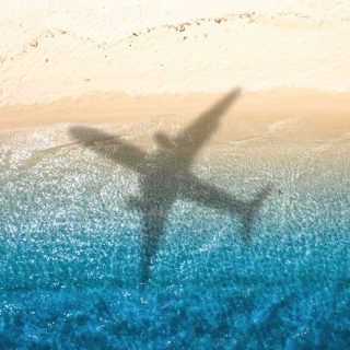 Colorful pins on world map showing global migration trends and relocation destinations across continents