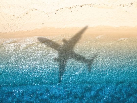 Colorful pins on world map showing global migration trends and relocation destinations across continents