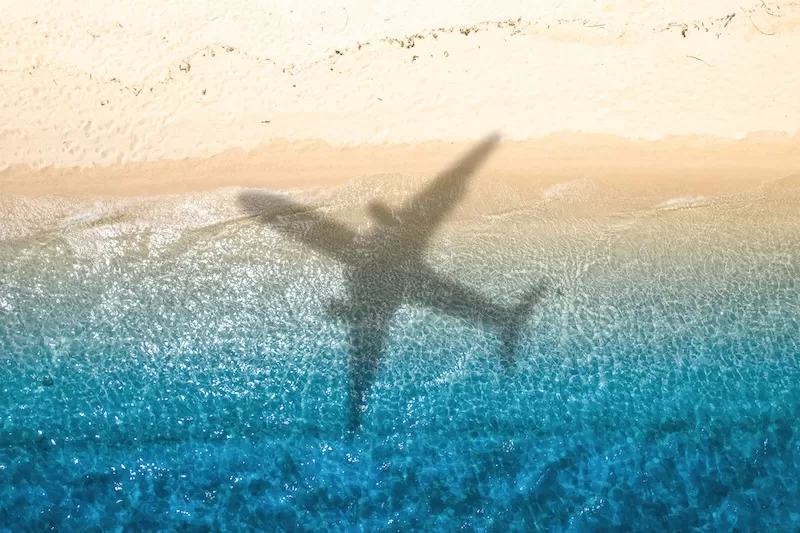 Colorful pins on world map showing global migration trends and relocation destinations across continents