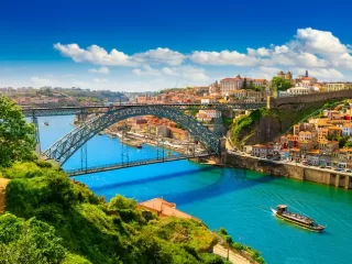 Porto Portugal cityscape with colorful buildings cascading toward Douro River showing why it's becoming Europe's top expat destination for living and remote work