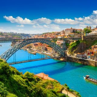 Porto Portugal cityscape with colorful buildings cascading toward Douro River showing why it's becoming Europe's top expat destination for living and remote work