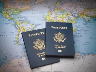 Brown leather travel bag with passport and boarding pass at airport check-in counter showing international travel and global mobility for expats planning relocation