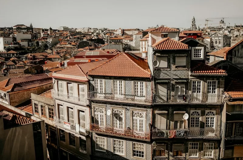 Mix of historic 14th-century buildings and modern architecture in Porto showing how the city balances tradition with progress appealing to expats and remote workers