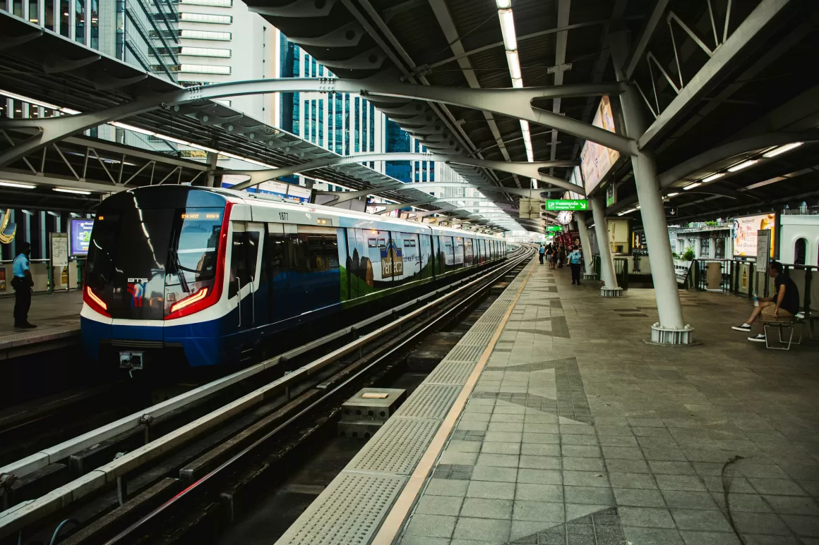 The modern Bangkok Skytrain at a station, highlighting the importance of efficient public transport for solo travelers navigating new cities with ease and safety.