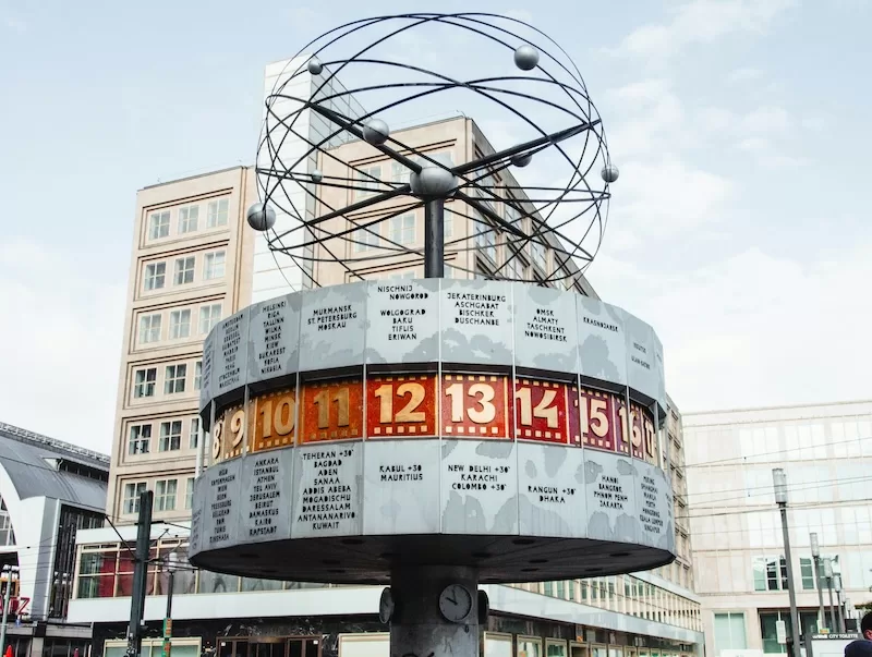 The World Clock (Weltzeituhr) in Alexanderplatz, Berlin, symbolizing the global nature of bleisure travel and the ability to work across different time zones