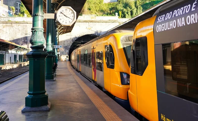 Yellow trains departing from historic São Bento station in Porto connecting to cities across northern Portugal showing excellent public transportation for expats
