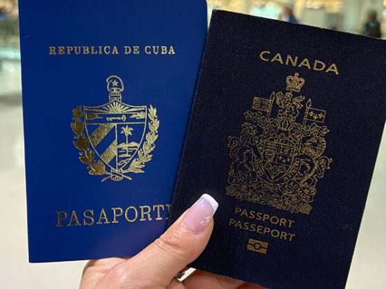 Two passports including a blue Cuban passport and a Canadian passport held together, representing international travel and dual citizenship documentation