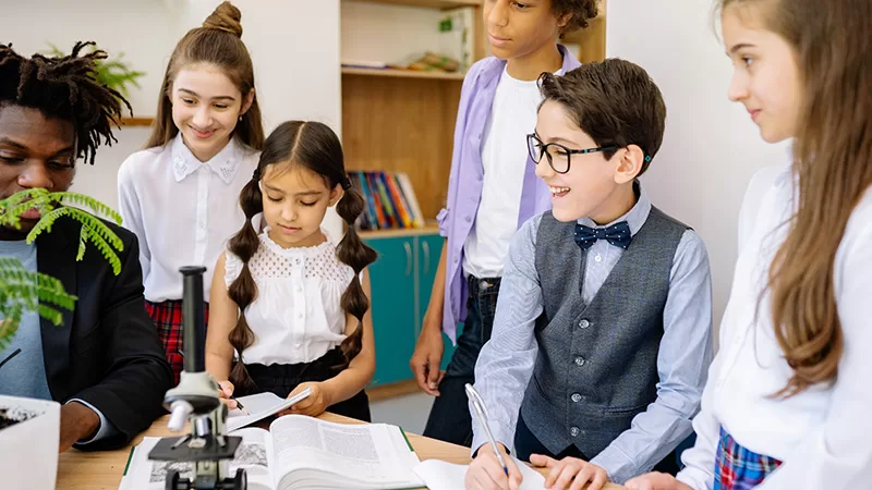 Children collaborate and learn together in a classroom.