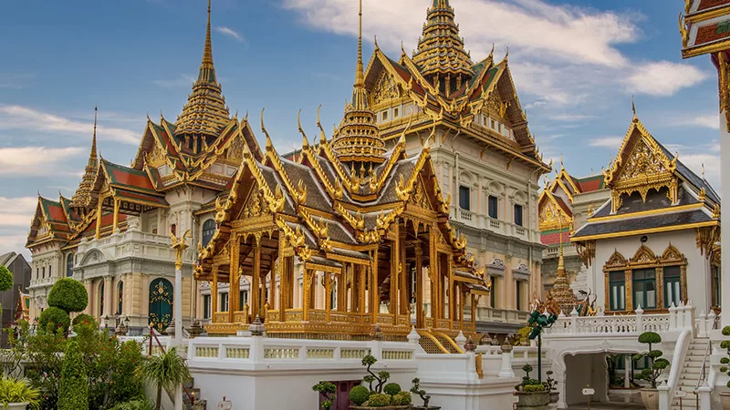 Grand Palace Bangkok with golden spires and Thai architectural details