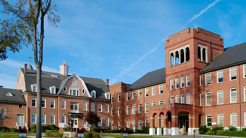 A university campus features traditional academic buildings.