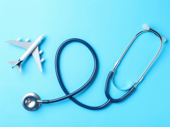 Stethoscope shaped around airplane symbolizing international healthcare access
