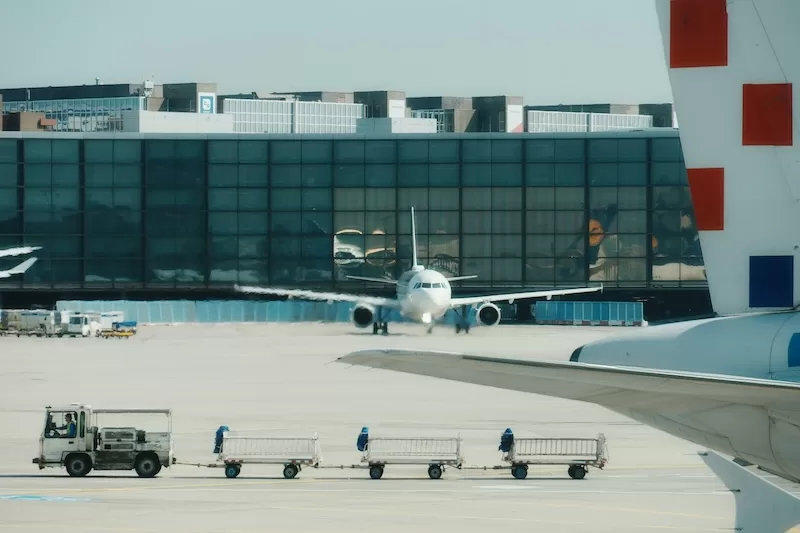 commercial aircraft taxiing at international airport amid rising global tensions