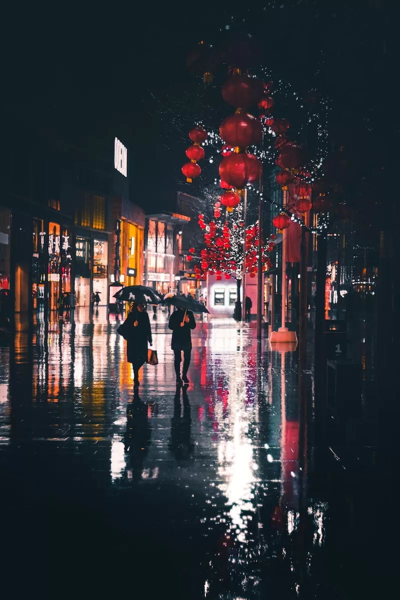 City street in China with red lanterns reflecting cultural and economic atmosphere