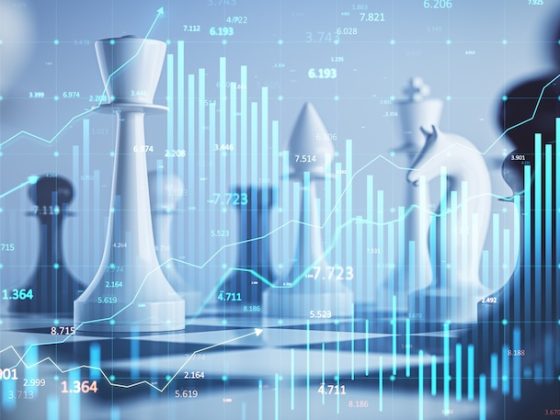 Chess pieces on a board overlaid with financial charts and data visualizations representing strategic financial planning