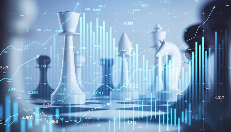 Chess pieces on a board overlaid with financial charts and data visualizations representing strategic financial planning
