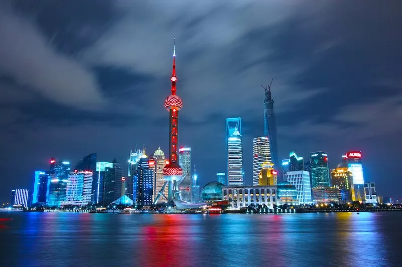 Shanghai skyline at night representing China’s growing global influence and infrastructure